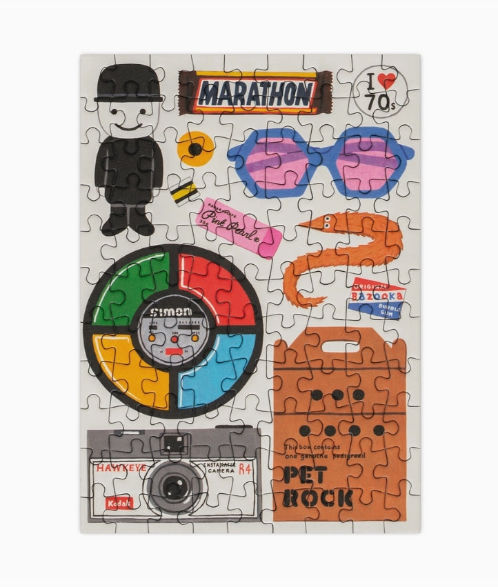 Jigsaw puzzle with retro-themed pieces on a white background