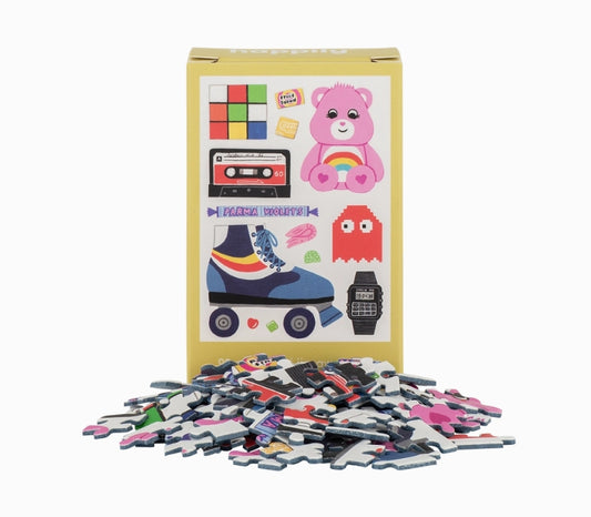 Puzzle pieces and packaging with colorful illustrations on a white background