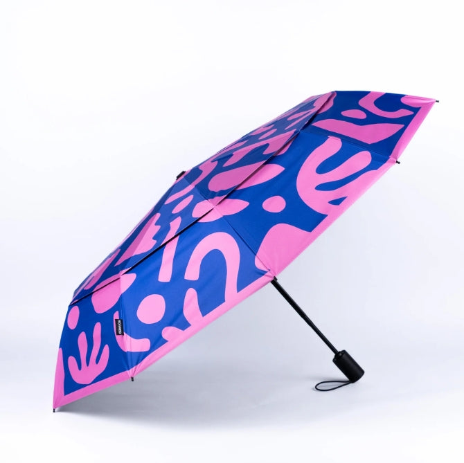 Blue and pink patterned umbrella on a white background
