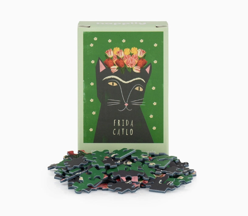 Frida Catlo puzzle with packaging featuring a cat illustration on a white background