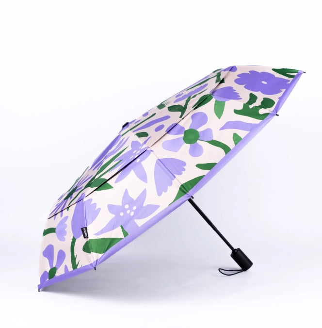 Floral-patterned umbrella with purple flowers on a white background